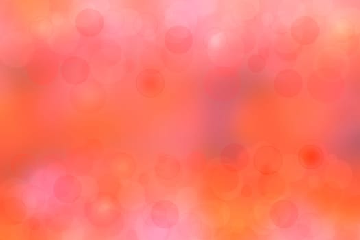 A festive abstract orange pink gradient background texture with glitter defocused sparkle bokeh circles. Card concept for Happy New Year, party invitation, valentine or other holidays.
