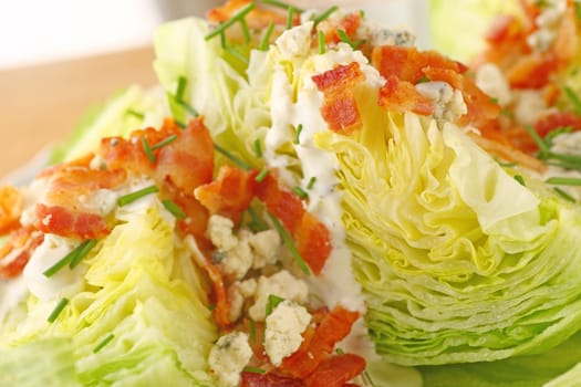 Bacon and blue cheese on fresh lettuce wedges with chives