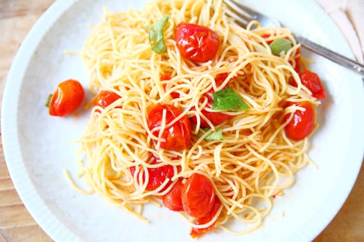Vermicelli in a simple sauce of cherry tomatoes, olive oil, garlic and basil