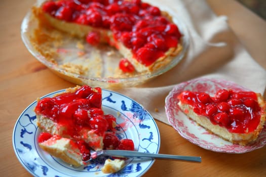 A cherry cream cheese pie served on decorative dishes