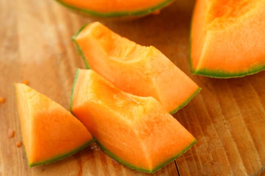 Closeup of juicy melon on a cutting board