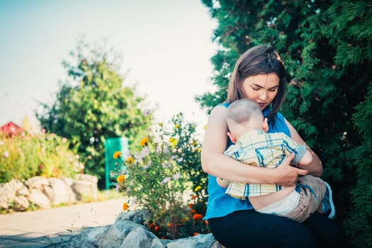 happy mother and toddler son on nature background.