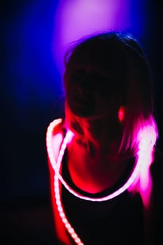 Portrait girl Strip Light LED tape on dark color background.