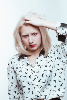 portrait blonde albino girl in studio on white background.