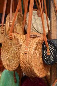 Balinese handmade rattan eco bags in a local souvenir market in Bali, Indonesia