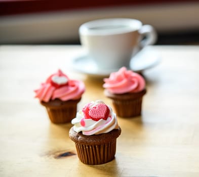 pink and white muffins  with coffee cup
