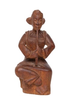 Close-up of  antique carved wooden figurine or sculpture from a asian man is sitting and playing a music instrument. Carved sculpture is isolated on white background. Macro.