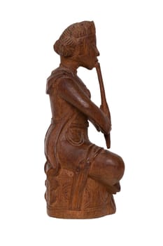 Close-up of  antique carved wooden figurine or sculpture from a asian man is sitting and playing a music instrument. Carved sculpture is isolated on white background. Macro.