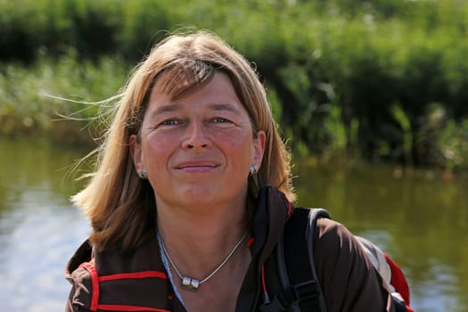 Woman in her fifties doing outdoor activity at the Baltic Sea