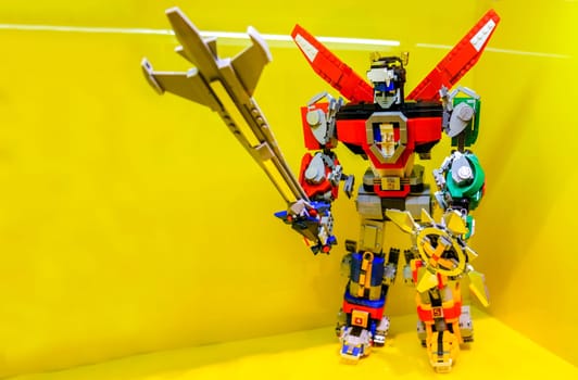 Bologna, Italy, 24 Feb 2019 - A Voltron robot action figure made of Lego bricks in the Lego Store of Bologna