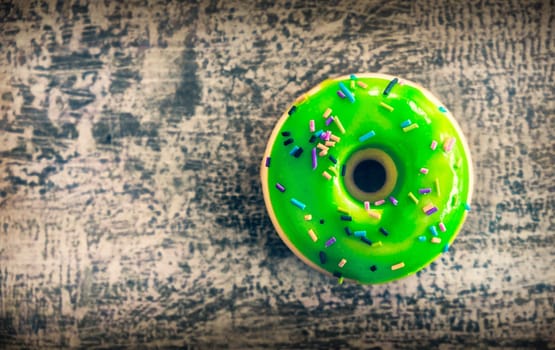 donut background top up view green toy toned photo .