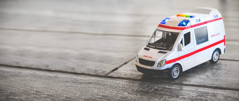 ambulance horizontal background health care toy sirens blue lights copy space .