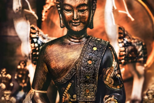 buddha meditating yoga background bronze orange statue .