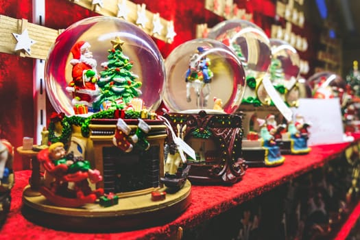 christmas snow globe background crystal ball with santa claus and christmas tree inside .