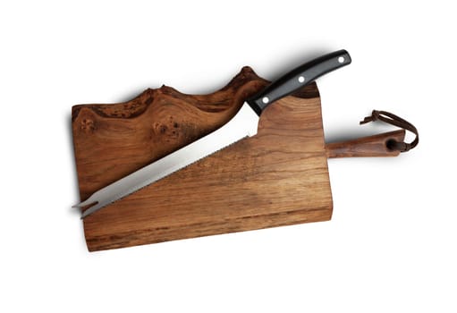 Knife Serrated for kitchen on old wooden cutting Board. Isolated on white background