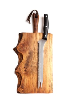 Knife Serrated for kitchen on old wooden cutting Board. Isolated on white background