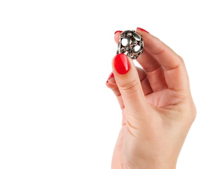 Female hands with red manicure wear a silver ring, isolated on white background