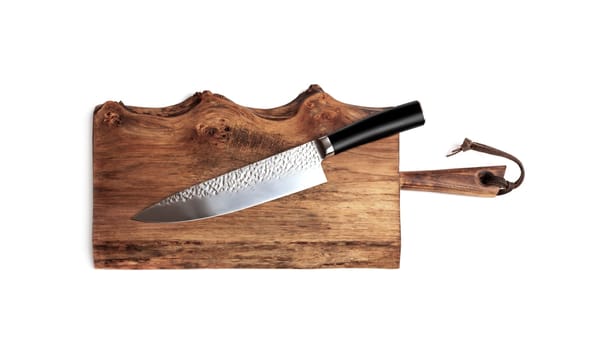 Knife Serrated for kitchen on old wooden cutting Board. Isolated on white background