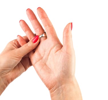 Female hands with red manicure wear a silver ring, isolated on white background