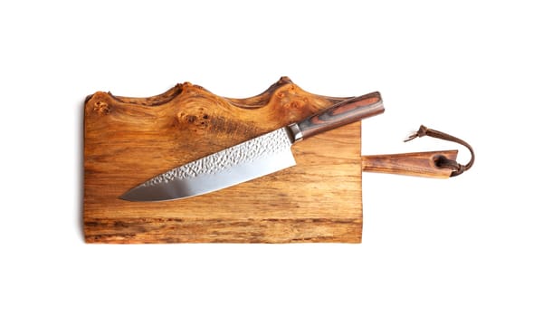 Knife Serrated for kitchen on old wooden cutting Board. Isolated on white background