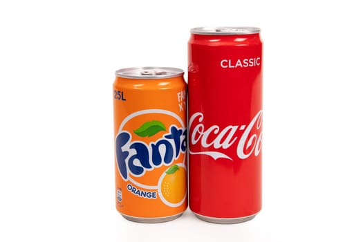 HUETTENBERG, GERMANY - JUNE 7, 2018: Cans of Classic Coca-Cola ant Fanta isolated on white. Coca-Cola and Fanta is a carbonated soft drink sold in stores, restaurants, and vending machines throughout the world.