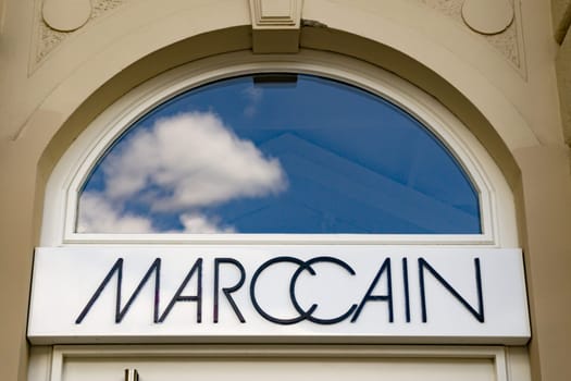 Wiesbaden, Germany - June 03 2018: MARC CAIN logo on a facade. Marc Cain is an international brand for woman’s fashion with its production facilities in Germany.
