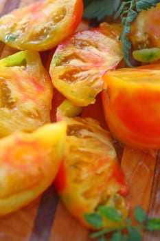 Fresh farmers market tomatoes on a cutting board