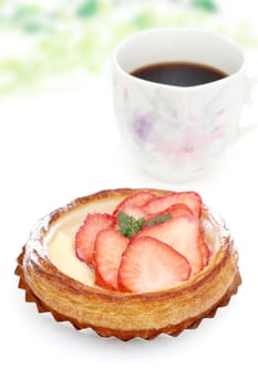 strawberry danish bread and cup of coffee for breakfast
