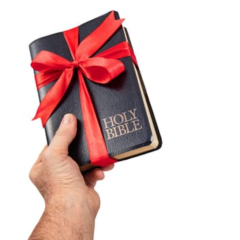 Hand giving the Holy Bible gift isolate on white backround