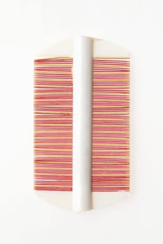 Traditional Chinese handmade wooden hair comb isolated on white background.