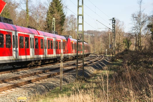 ESSEN KETTWIG, NRW, GERMANY - FEBRUAR 12, 2016:.Level crossing in Essen Kettwig an der Ruhr on Kattenturm..In driving, railway train toward Duesseldorf.