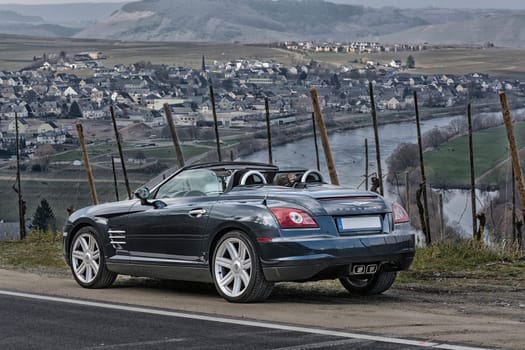 LEIWEN, GERMANY - MARCH 26, 2016:.Chrysler Crossfire on the Panorama Trail in the vineyards of Leiwen an der Mosel.
