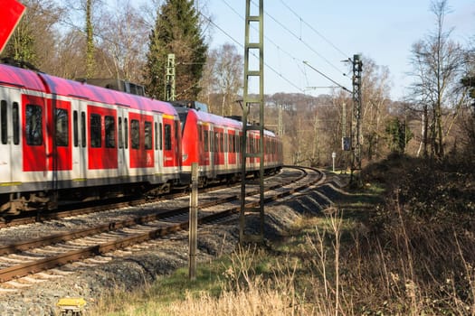 ESSEN KETTWIG, NRW, GERMANY - FEBRUAR 12, 2016:.Level crossing in Essen Kettwig an der Ruhr on Kattenturm..In driving, railway train toward Duesseldorf.