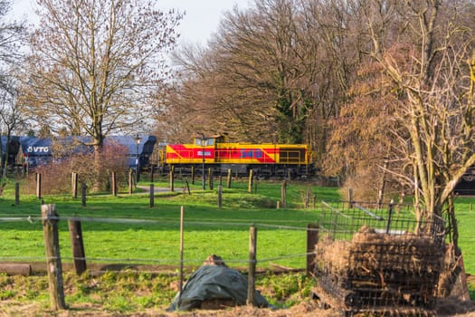 RATINGEN, NRW, GERMANY - DECEMBER 28, 2015:.Locomotive at the railroad crossing in Ratingen at the moated castle "house to house"". By propelled fast train towards Muelheim - food."