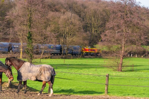 RATINGEN, NRW, GERMANY - DECEMBER 28, 2015:.Locomotive at the railroad crossing in Ratingen at the moated castle "house to house"". By propelled fast train towards Muelheim - food."