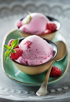 Homemade organic ice cream scoops with berries and raspberry