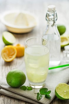 Lemonade or juice with lemon and mint, cold refreshing drink or beverage with ice