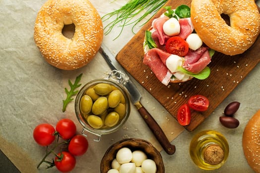 Bagel sandwich with prosciutto and mozzareela cheese. Healthy food.