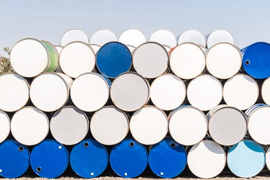 Industry oil chemical metal barrels stacked up in waste yard of tank and container, Kawasaki city near Tokyo Japan