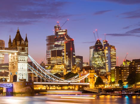 London Tower Bridge with London downtown skylines building in background, London UK.