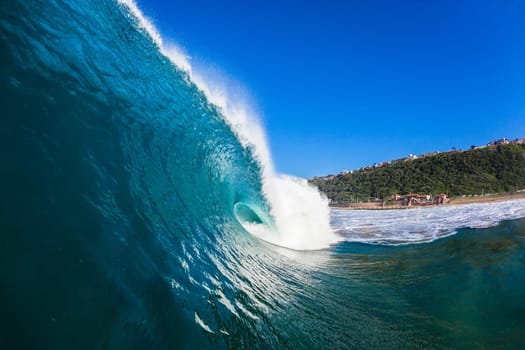Wave crashing hollow blue water ocean power