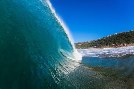 Wave crashing hollow blue ocean water ocean power