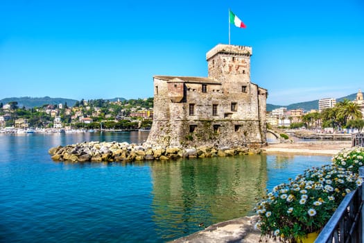 italian castles on sea italian flag - Rapallo Genoa Tigullio gulf near Portofino Italy .
