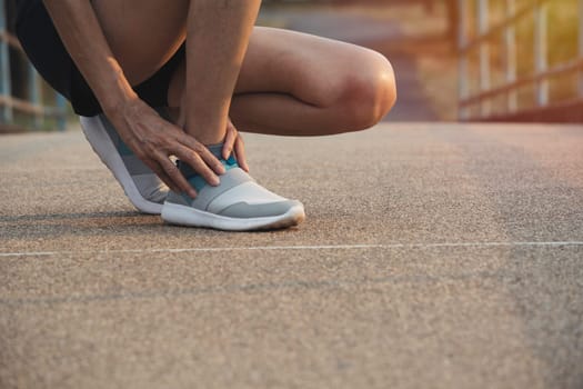 The female clings to a bad leg. The pain in her leg. Healthcare and painful concept.