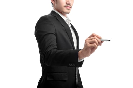Young asian businessman using marker to write something isolated over white background