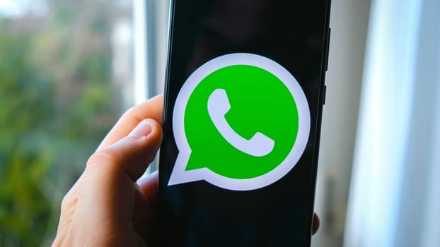 hand use Whatsapp  app symbol on smartphone in Bologna, Italy, 08 March 2019