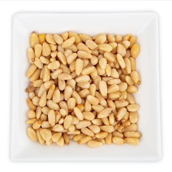 Fresh Pine Nuts in a bowl isolated on white background