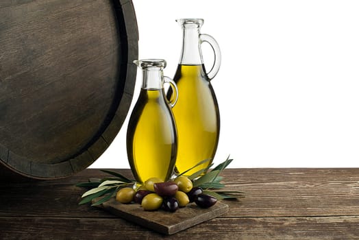 Bottles of Extra virgin healthy Olive oil with barrel background on white