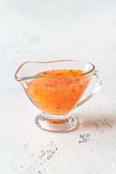 Thai sweet and sour sauce in the glass gravy boat