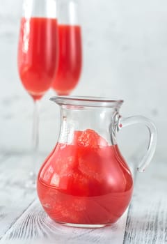Jug of Mimosa cocktail with grapefruit slices